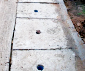 Completed Thaithong cement water channel with cover for safty and adding to width of road.